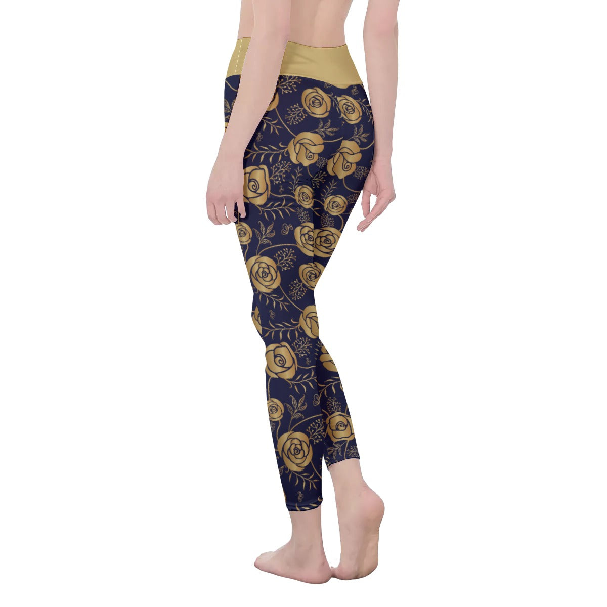 Rear left view of model from waist down wearing black leggings with a gold rose all over print design. The waist band is colored the same gold as the roses.